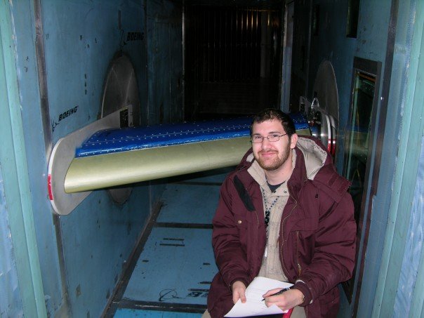 Daniel Z Schneider as a young engineer, beside a wing section in the Boeing icing tunnel